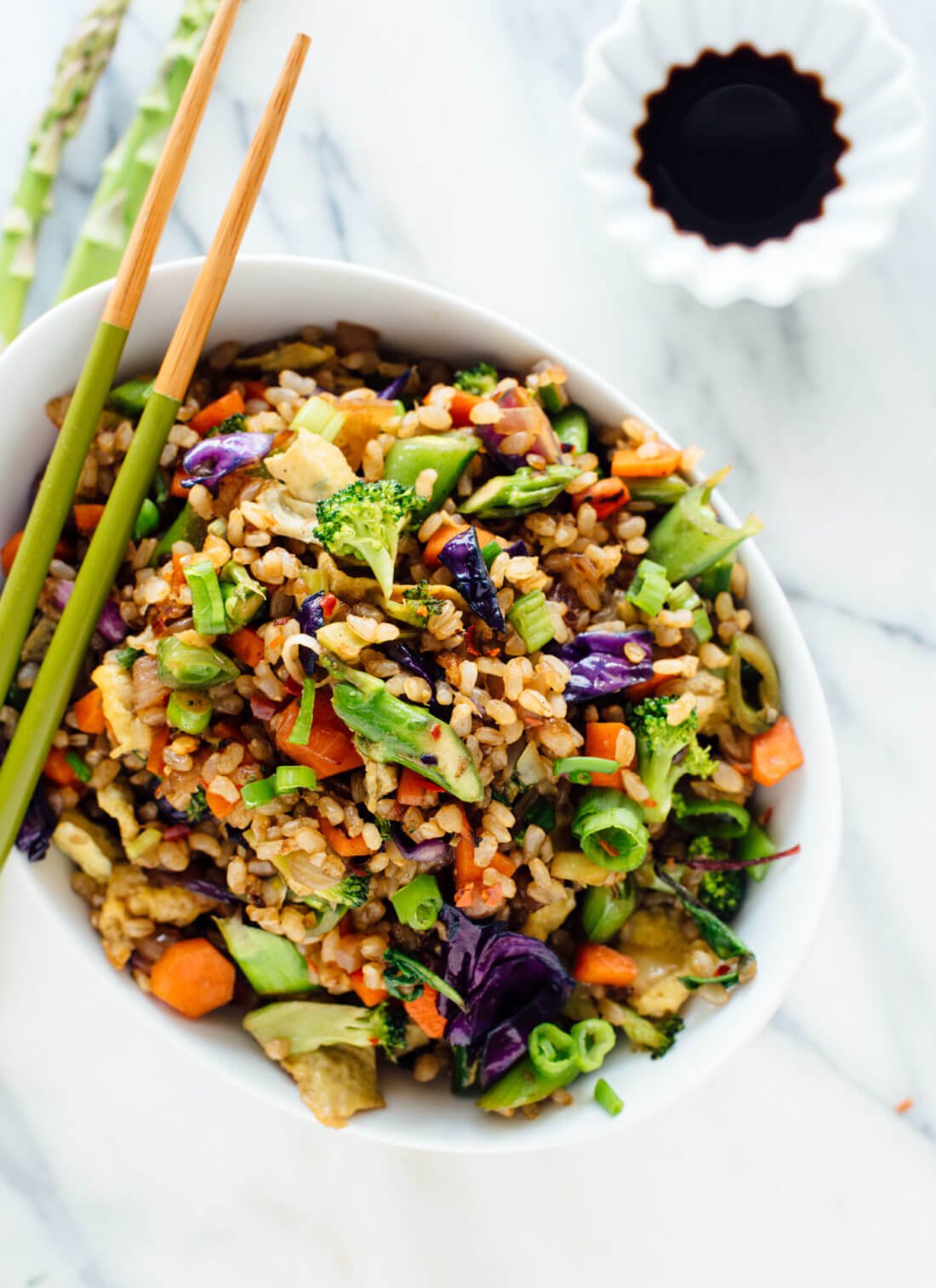 Vegetable fried rice made with extra veggies and brown rice, for health and flavor bonus points! Get the recipe at cookieandkate.com